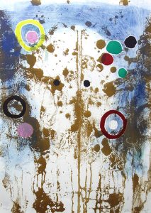 An abstract print depicts colorful, irregular dots and circles overlaid on brown splatters and drips. The left, right, and top edges have a blue background, blending into white toward the center.